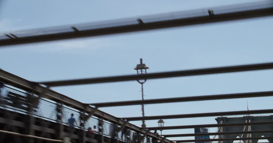 Cars are driving on a bridge in the day time
