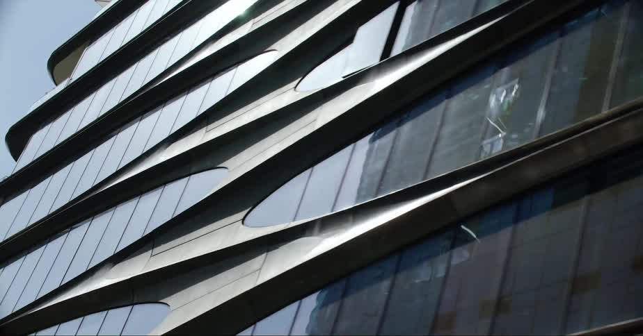 Exterior view of office building in the city street on sunny day