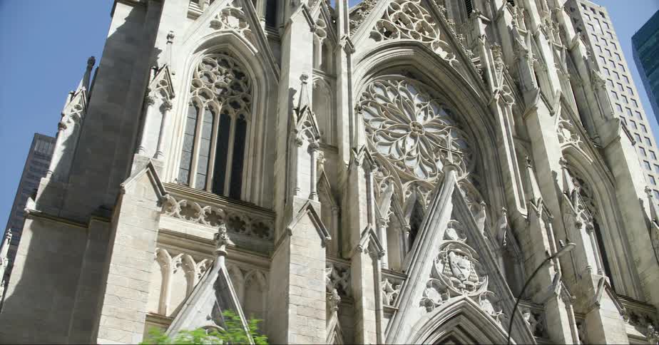 Cathedral in a City amongst Skyscrapers with an ornate facade