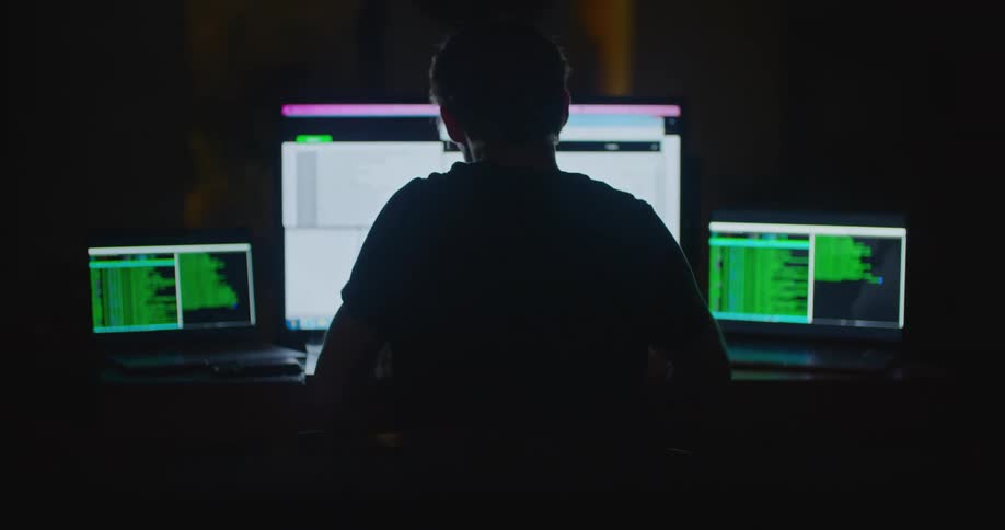 A man using a computer in an office