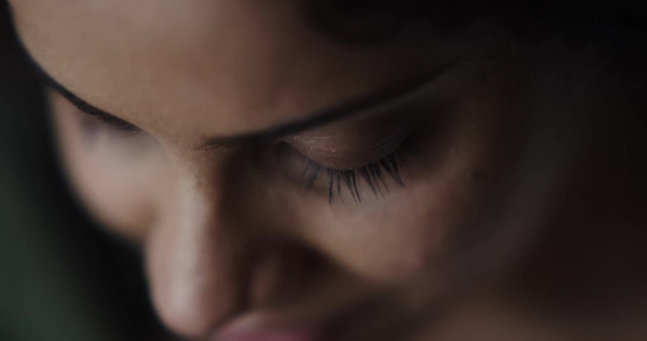 Close up of a woman looking down and smiling