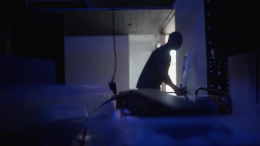 An electrician is working on the wiring of a home