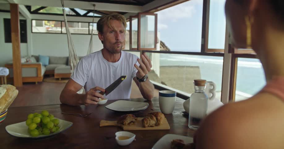 Two people having food indoors