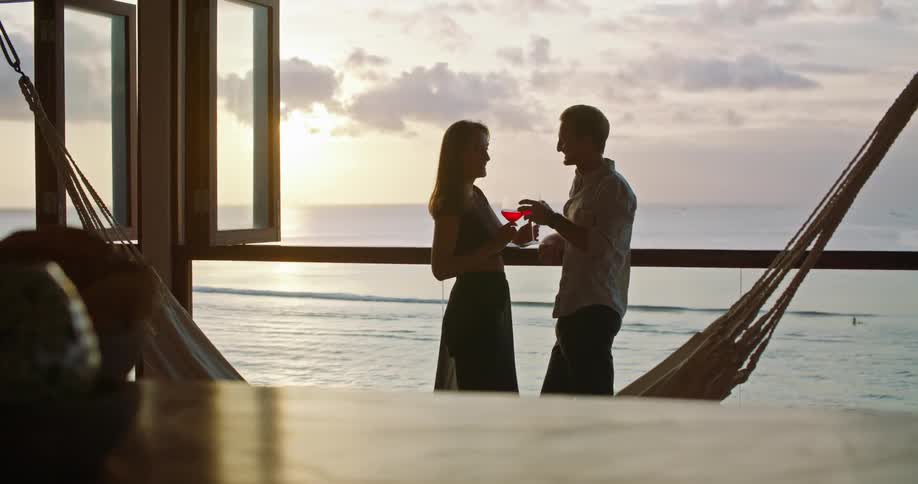 Two people drinking wine outdoors