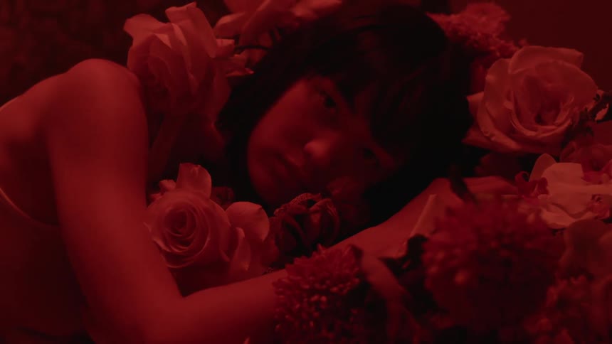 A woman is resting with some flowers
