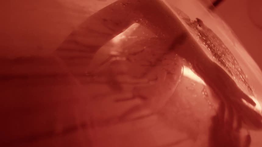 A woman is in the shower