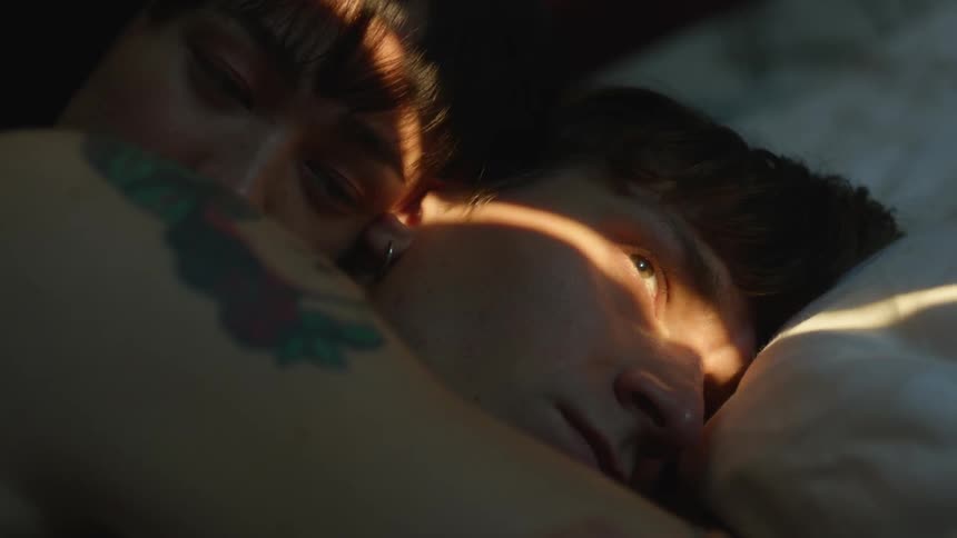 A couple rest in bed
