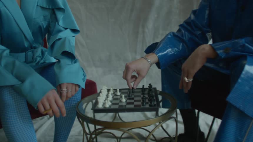 Two people are playing chess