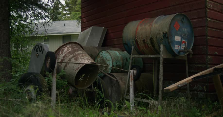 Barrels are stacked in the yard