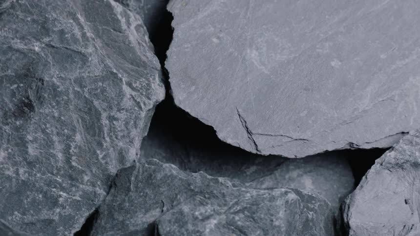 The tops of flat gray rocks overlapping