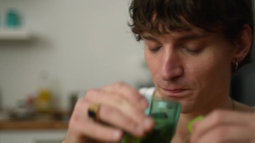 A man drinks some tea