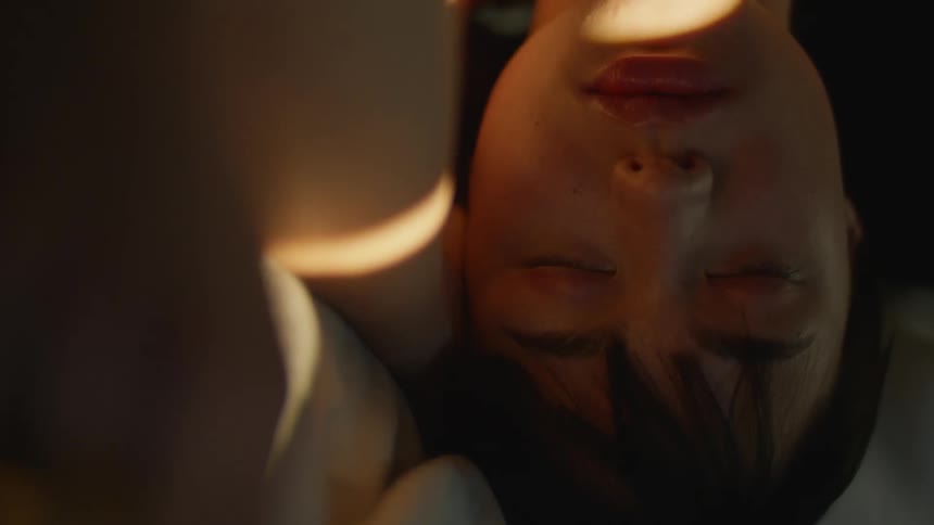 A person sleeping in a bed