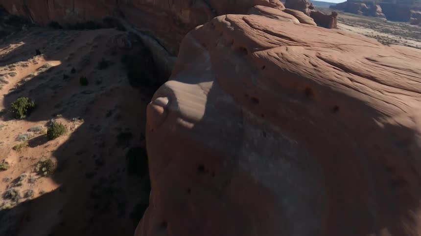 Lines form along the curves of a vast canyon