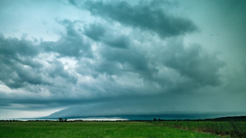 Storm clouds and lightning above a grassland