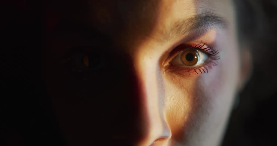 Close up view of a womans face is displayed