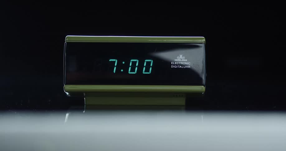 Close up of modern digital clock striking seven