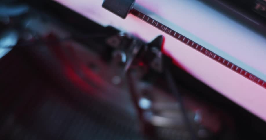 An old typewriter is typing on a sheet of paper