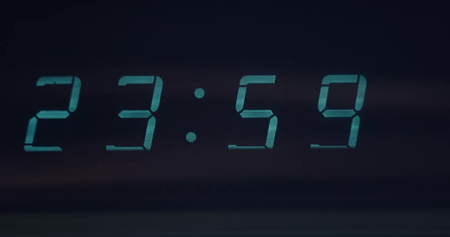 Close up of digital clock striking midnight