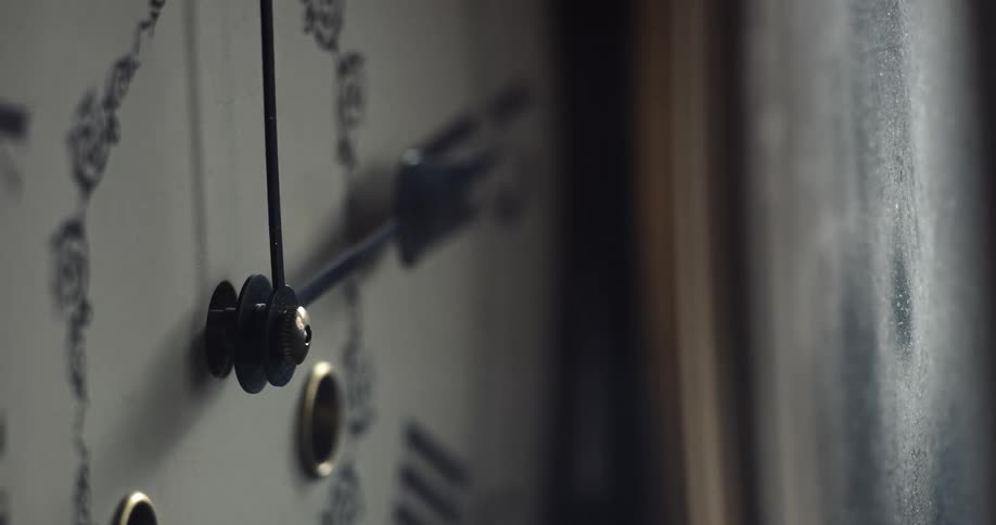 Close up view of a clock is displayed indoors