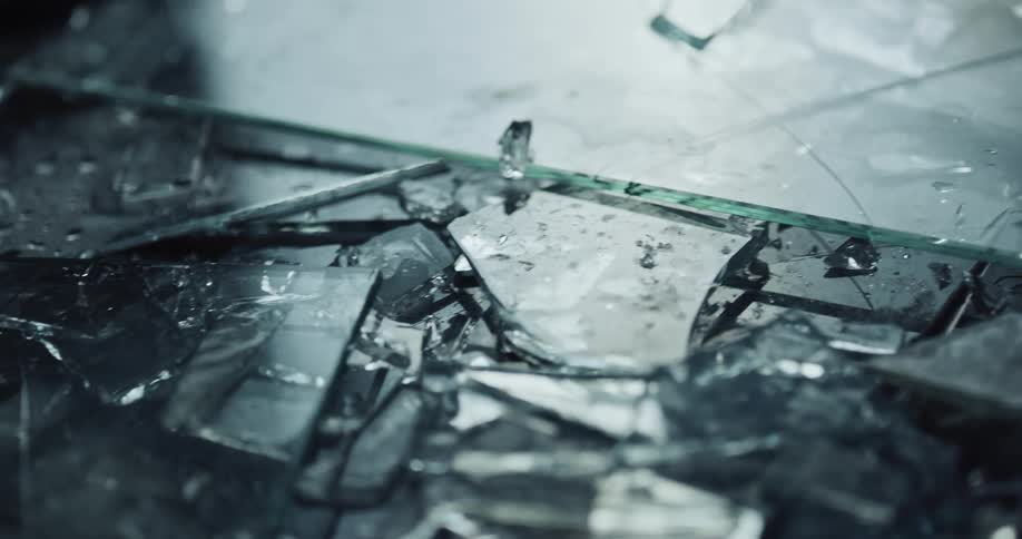 Shards of broken glass is covering the floor