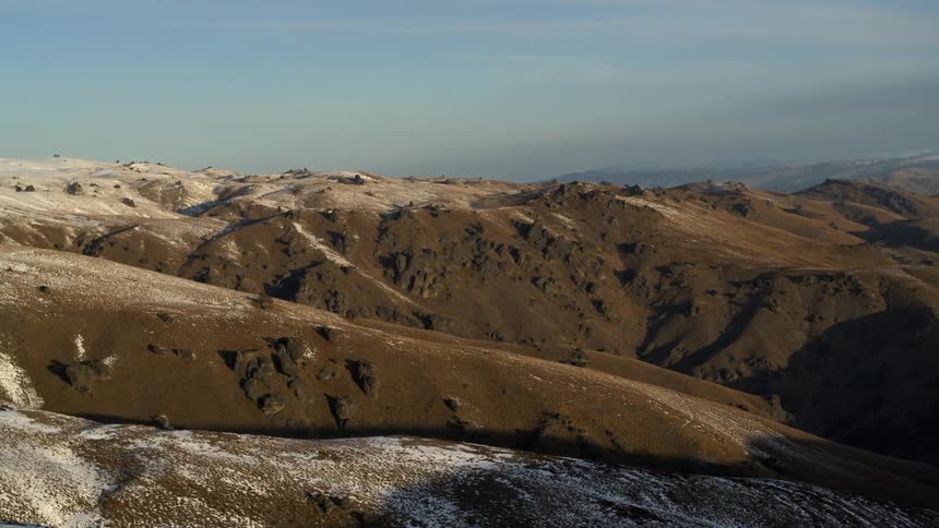 Aerial view of barren mountains and hills