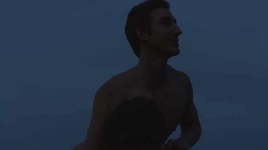 Couple of shirtless friends playing outdoors at evening