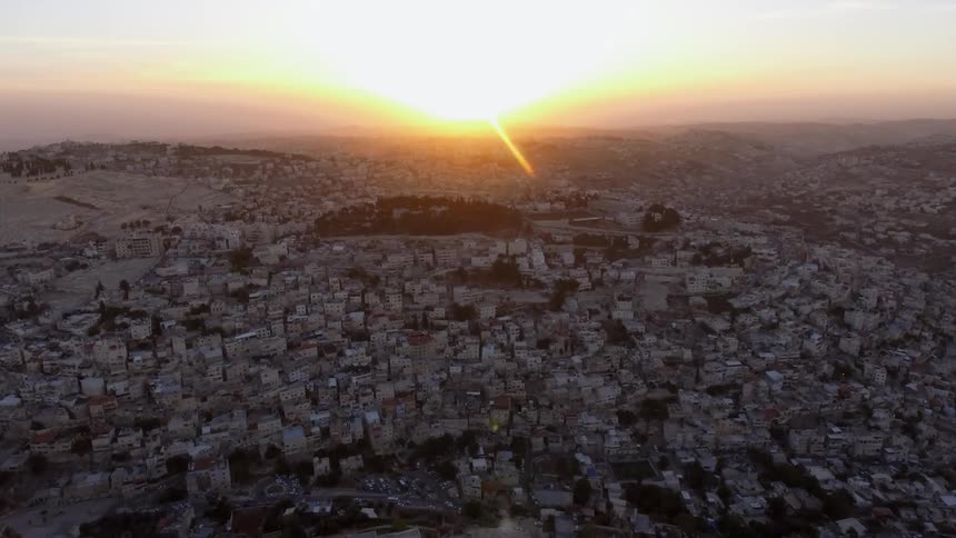 A tightly packed city at sunset