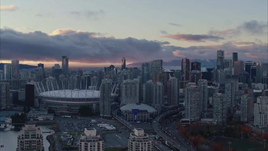 Aerial view of BC Place stadium in the middle of downtown Vancouver city at sunset