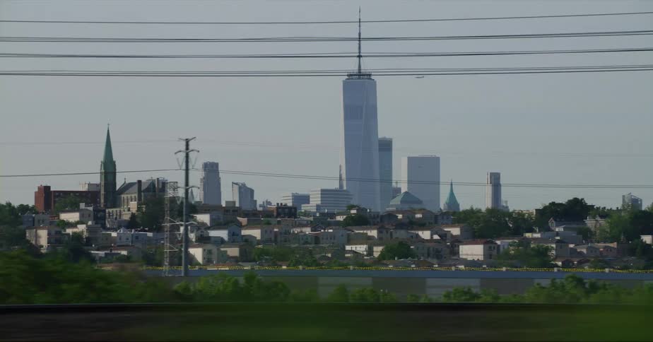 One world trade center in new york city seen from a moving vehicle at evening