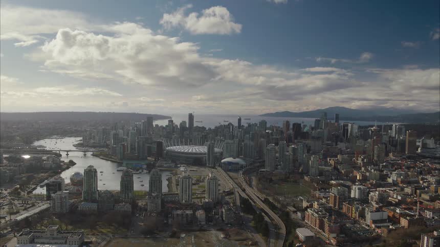 Aerial view of downtown Vancouver from a distance in the afternoon