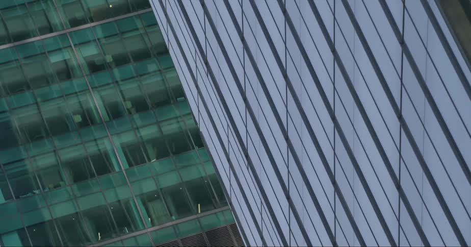 Windows on the facade of tall skyscrapers in the city