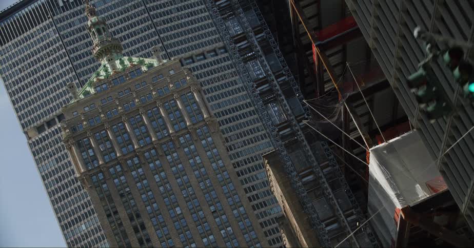 Tall skyscrapers loom over an intersection
