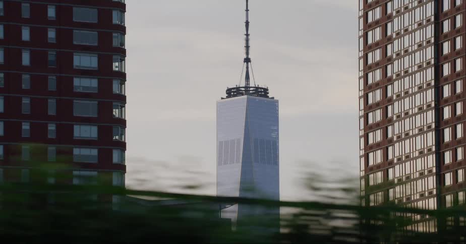 Traveling past buildings including the one world trade center tower in nyc