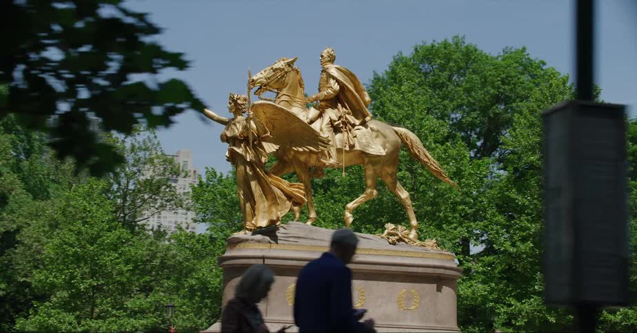 People walk through the park in the city