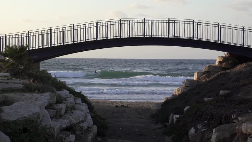 A bridge near a body of water during the day