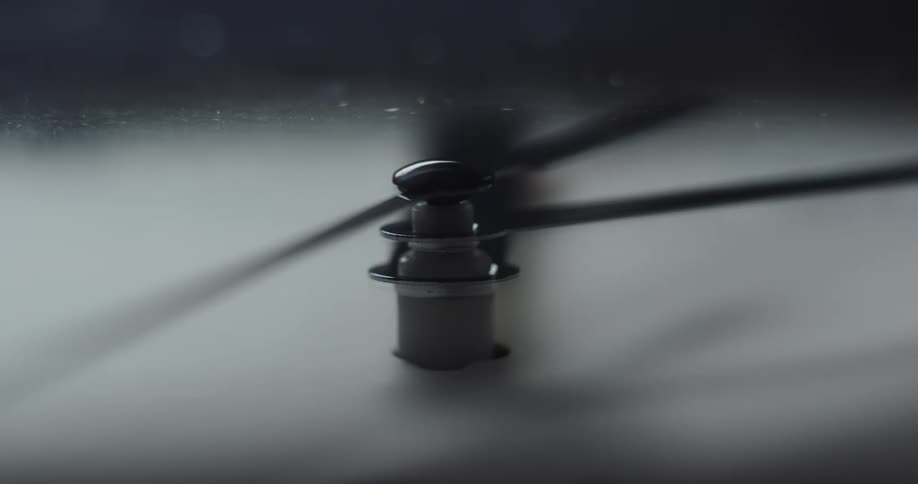 The hand on a clock ticks around the face