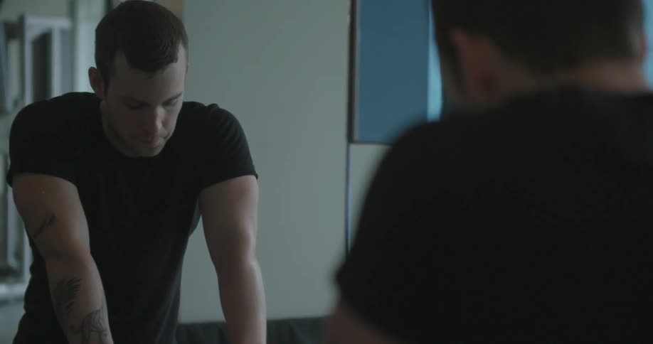 A man looks in the mirror