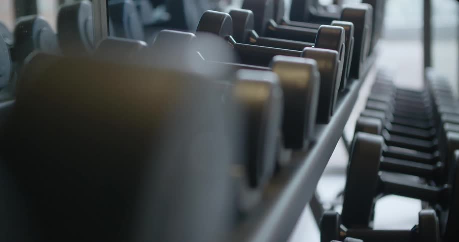 Close up of weights sitting on a rack