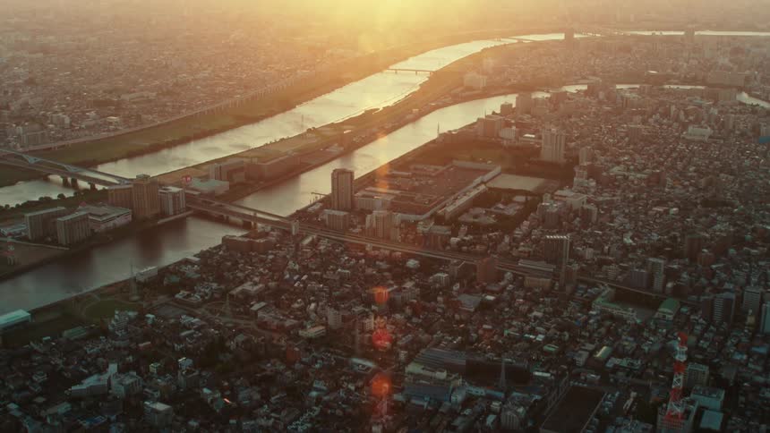 The sun is rising on the city