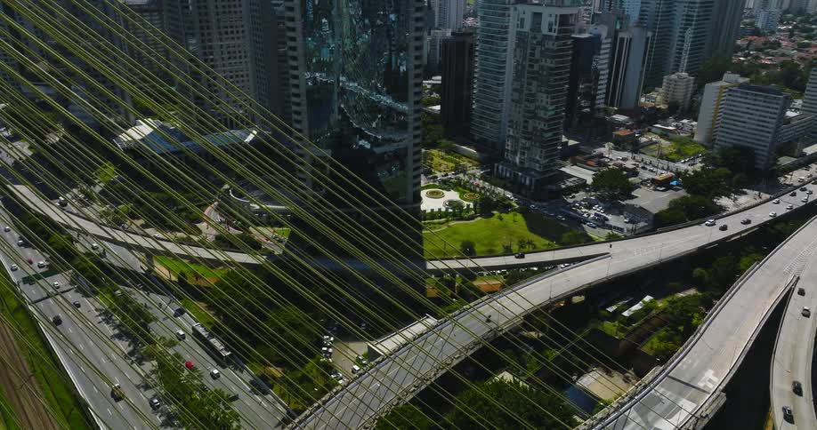 Cars and trucks traveling on sao paulo highways and over the ponte estaida bridge