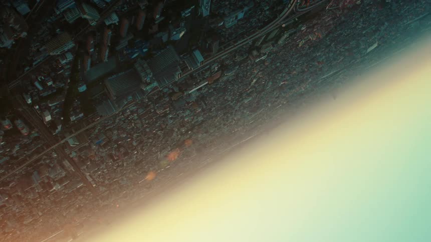 An upside down aerial view of buildings in a city