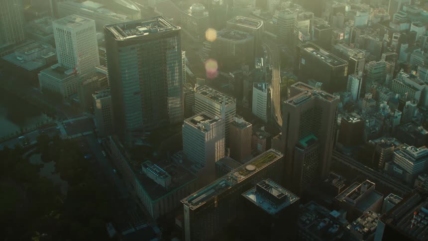 Vehicles drive down an interstate that winds through downtown
