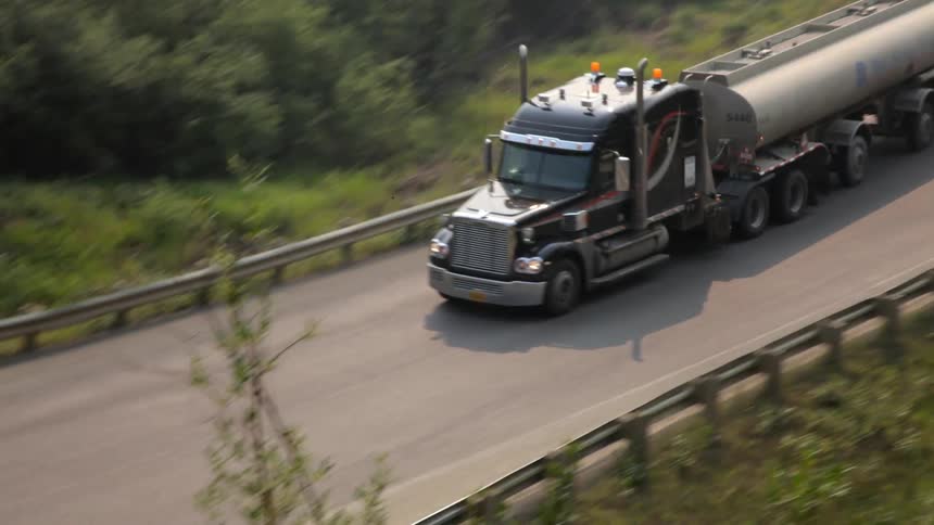 A truck drives down a highway