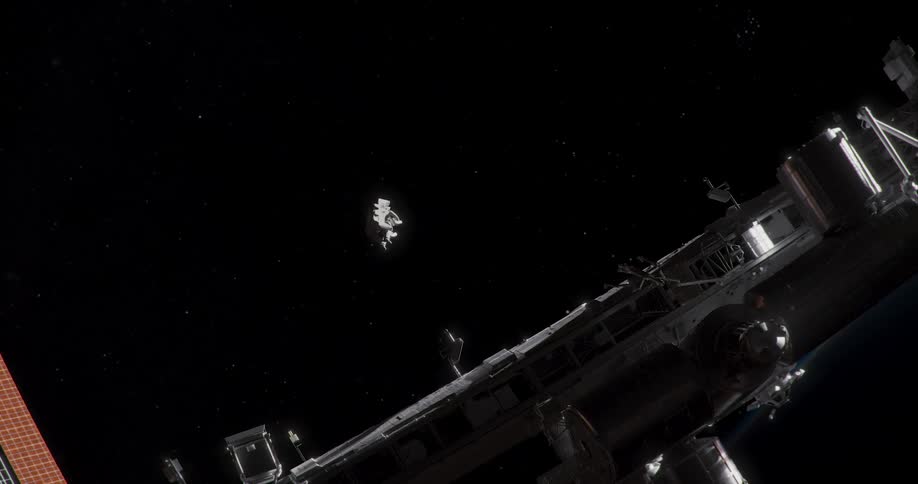 An astronaut in a space walk suit floats toward a space station in outer space