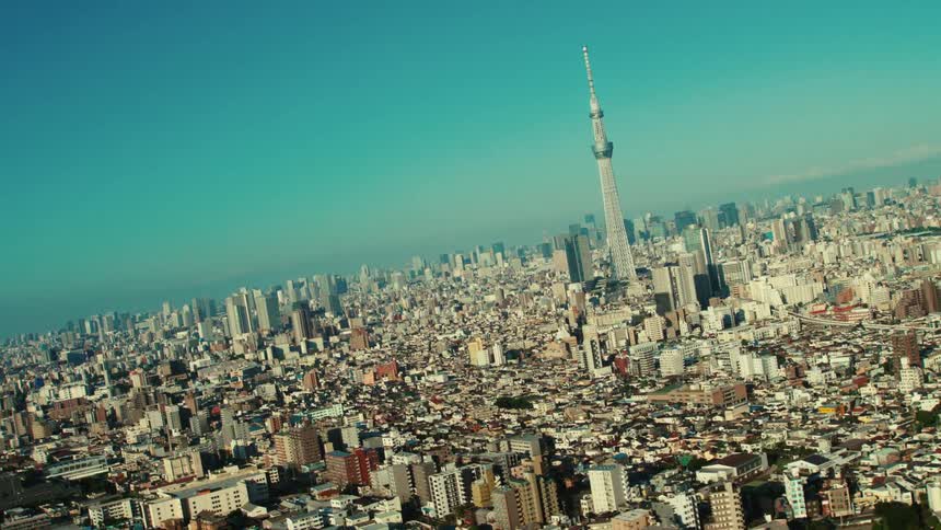 An aerial view of buildings and skyscrapers in a dense city