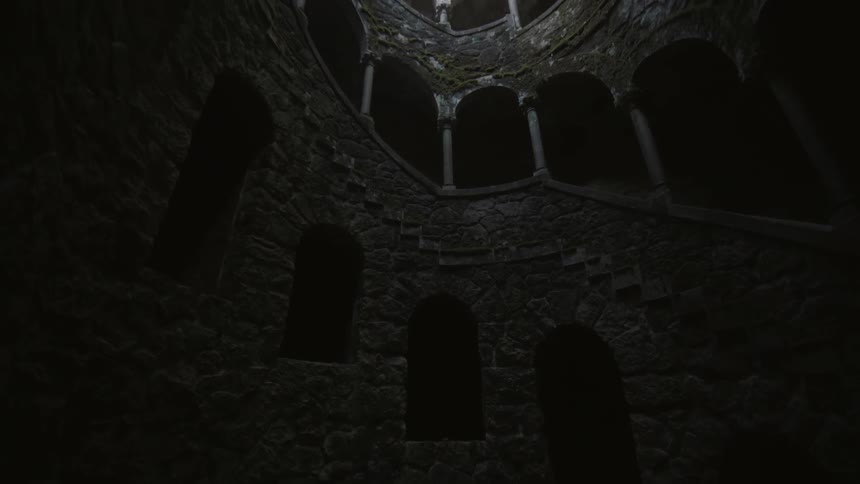 A stone staircase spirals overhead
