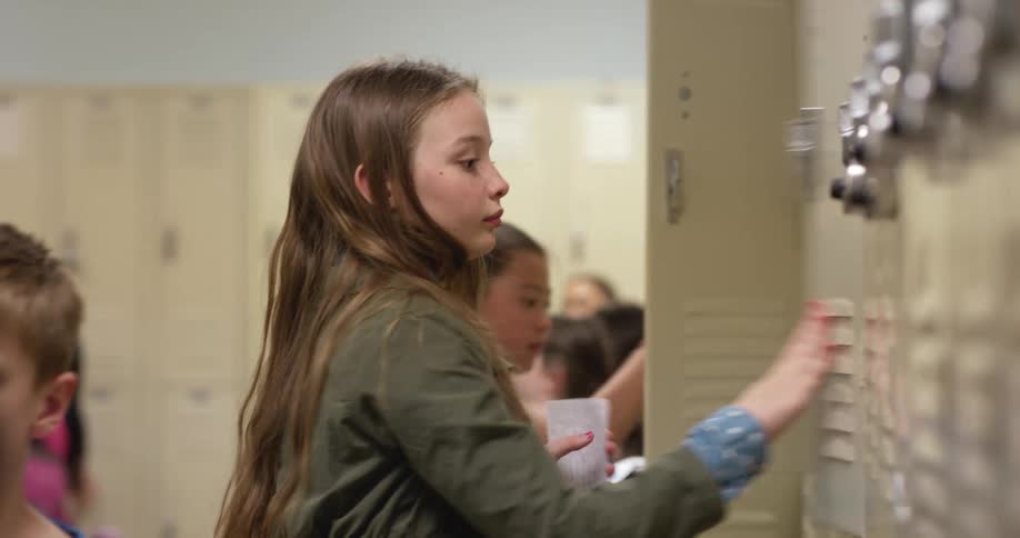 Children use lockers in a school