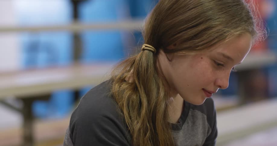 A girl is looking at something off screen