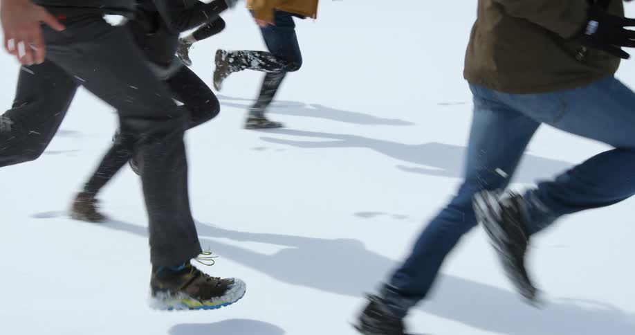 People are racing over a snow covered field