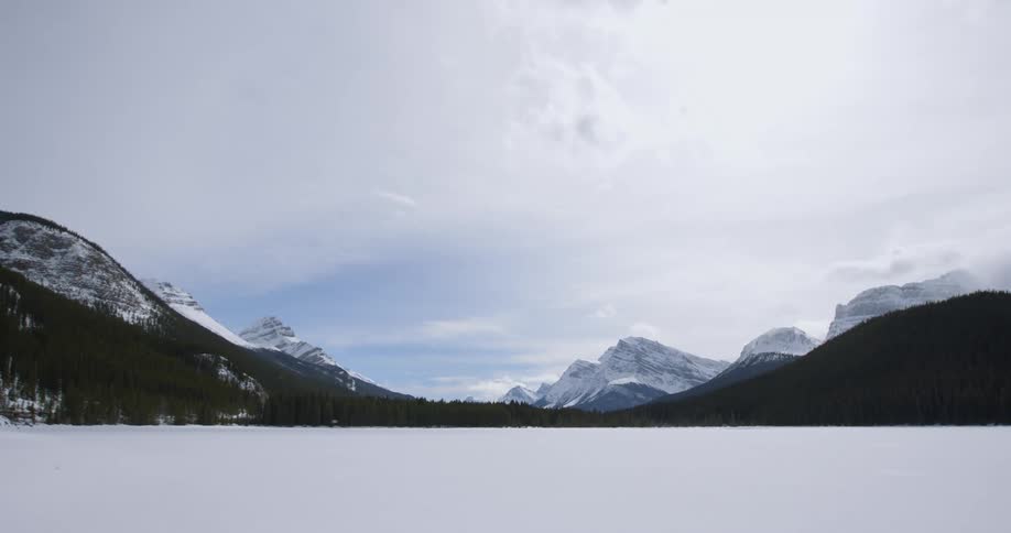 View of snow-capped mountains under a cloudy sky